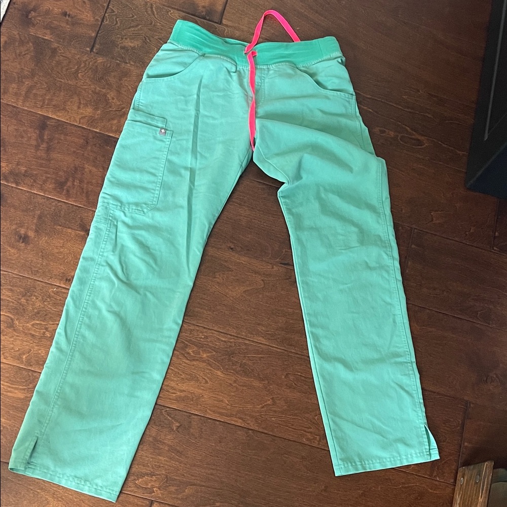 FIGS Women's surgeon Green Cade scrub pants with Pink Drawstring